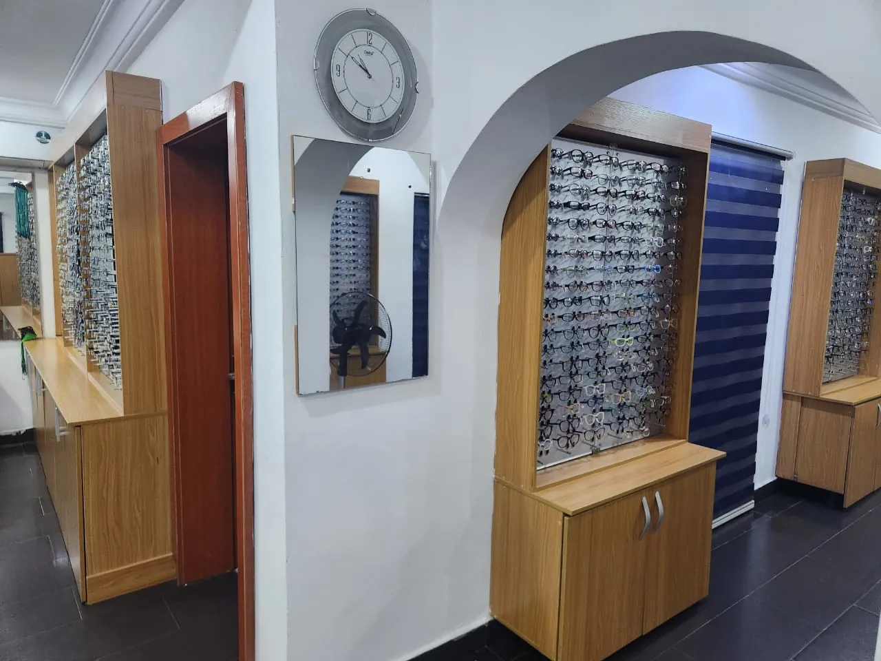 The fully stocked eyewear frame display wall at Locus Eye Clinic