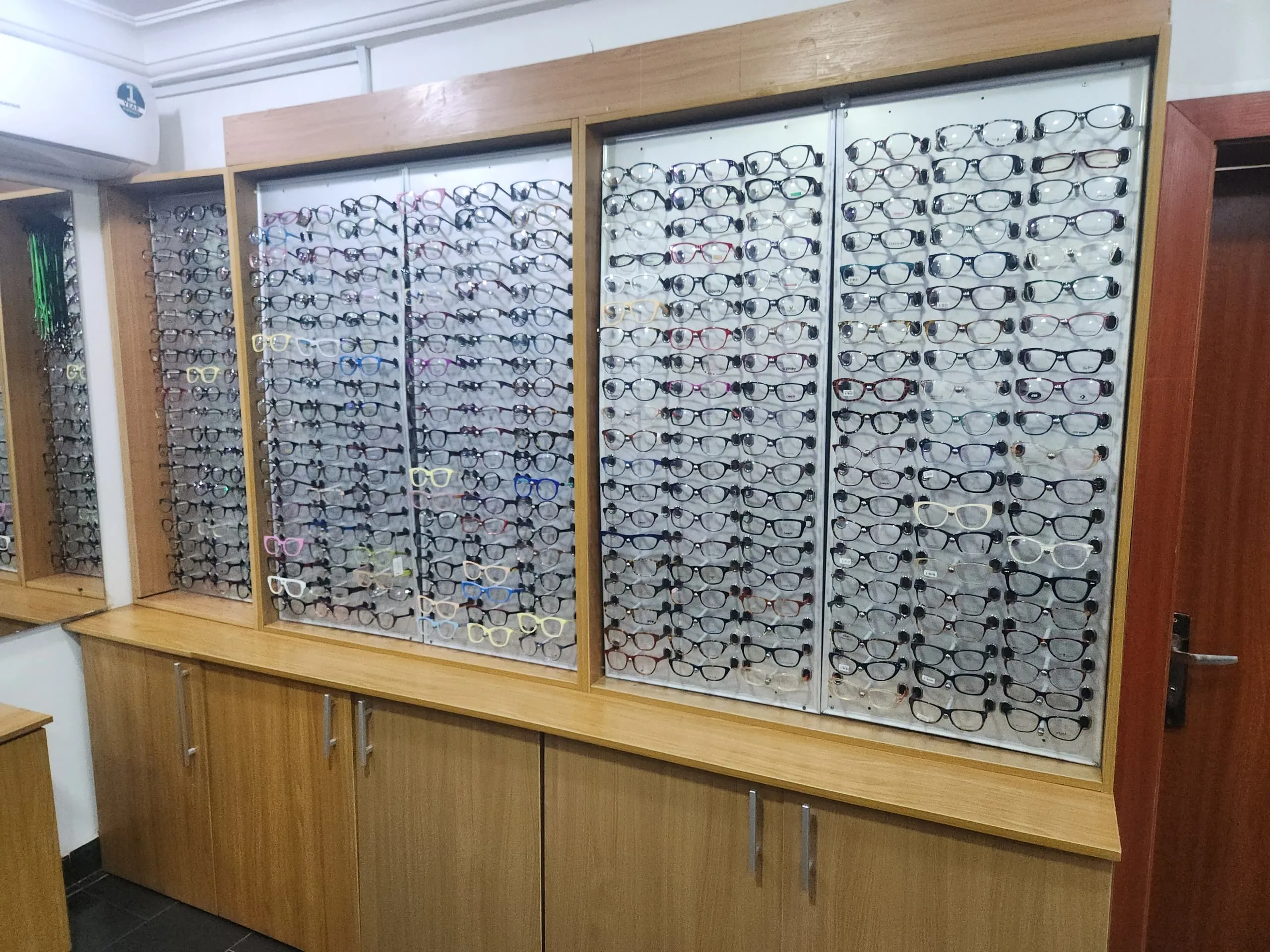 The eyewear frame display wall at a Locus Eye Clinic location